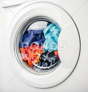 Washing machine with color clothes Stock Photos