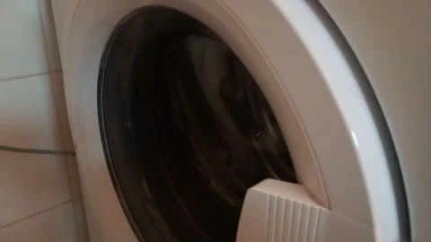 Washing Machine Constant Wash Cycle Hum and Drum Rotation -- Close-up on Door Du 스톡 동영상 338170414