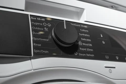 Washing machine control knob with visible wash programs. Front loading appl.. Foto stock