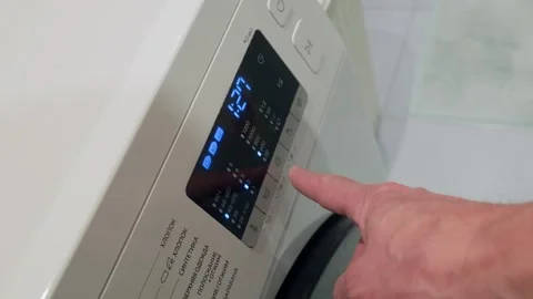 Washing machine control panel displaying cycle in operation close up 動画素材 341559601