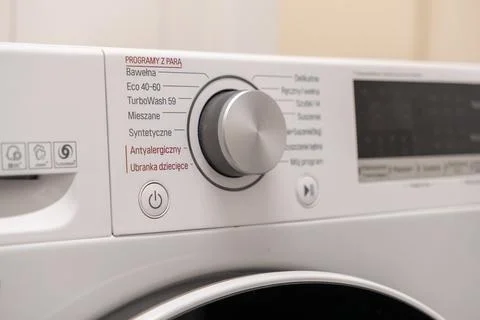 Washing machine control panel with rotary program knob, displaying diverse .. Stock Photos