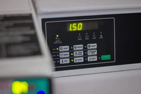 Washing machine control panel with selected washing program Stock Photos