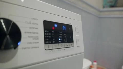 Washing machine display panel showing cycle time during operation 스톡 동영상 341558750