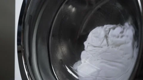 The washing machine does the white laundry. Stock Footage 220935715