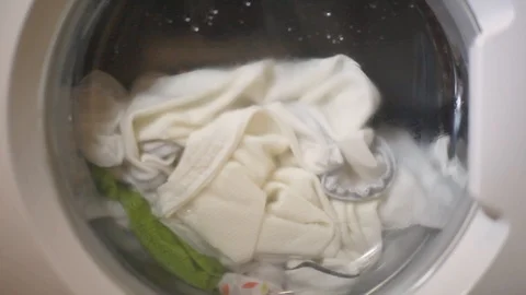 Washing machine doing laundry, spinning tub Video stock 105275544