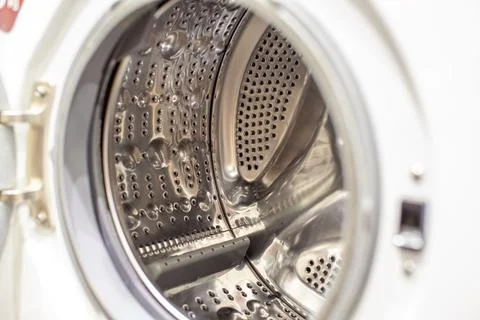 The washing machine drum is dry and clean close-up. Washer Stock Photos