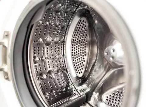 The washing machine drum is dry and clean close-up. Washer Stock Photos
