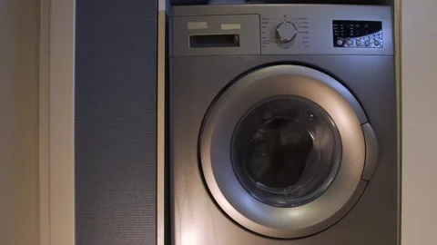 Washing machine drum slowing down close-up front view during spin drying braking Video stock 333649177