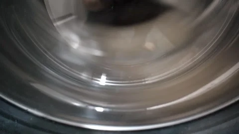Washing machine drum spinning close up Stock Footage 327402581
