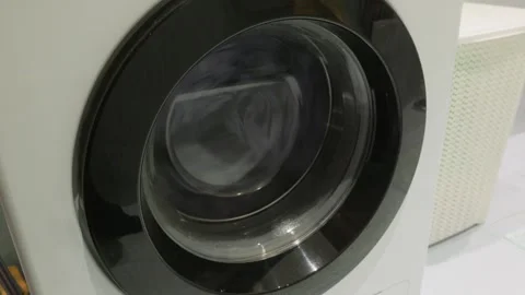 Washing machine drum spinning close up during wash cycle Video stock 341558828