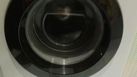 Washing machine drum spinning close up with original audio Video stock 341559443