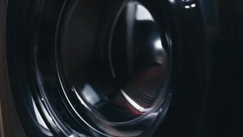 Washing machine drum spinning, creating abstract patterns and motion blur on its Stock Footage 344912207