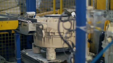 Washing machine drums moving on automatic line at manufacturing factory Stock Footage 115972929