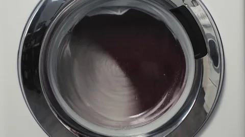 The washing machine is full of laundry and running Stock Footage 79417804