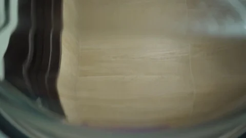 Washing machine inside. Man laying on linen washing Stock Footage 82618473