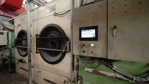 Washing machine-integrated fabric dyeing assembly line Stock Footage 247411450