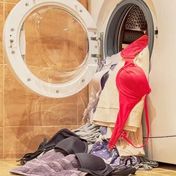 Washing machine loaded with clothes Stock Photos