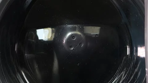 The washing machine is loaded with laundry, the drum with water Stock-Footage 315727095