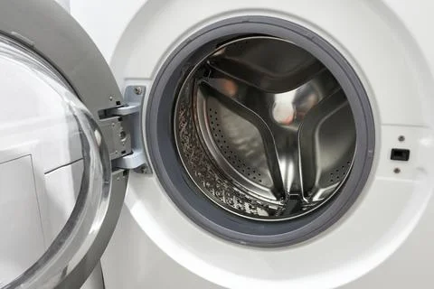 Washing machine with open door, close-up, shallow depth of field Foto stock