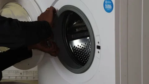 Washing machine repairing by a working professional expert man. Stock Footage 228397725