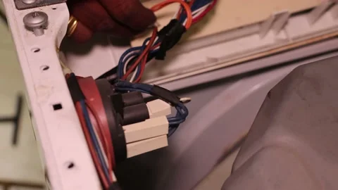 Washing machine repairing by a working professional expert man. Stock Footage 228397892