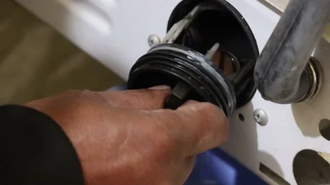 Washing machine repairing by a working professional expert man. Stock Footage 228397998