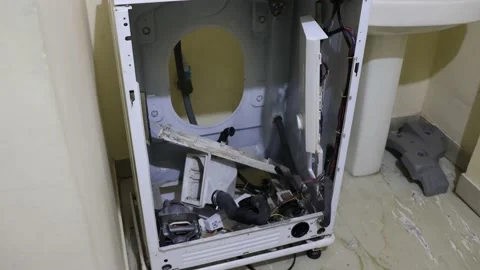 Washing machine repairing by a working professional expert man. Stock Footage 228398029