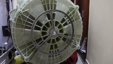 Washing machine repairing by a working professional expert man. Stock Footage 228398038