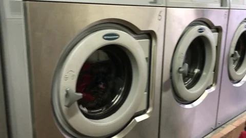 Washing machine room. Rows of washing machines at local laundry Stock Footage 71135624
