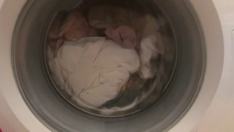 Washing Machine Spinning with clothes inside Stock Footage 137823603