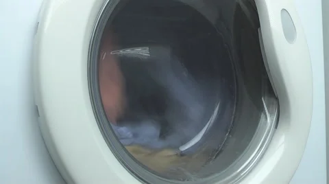 Washing machine spinning washes clothes Stock Footage 46397522