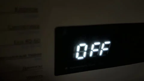 Washing machine turning on and off with digital display close up at home, Stock Footage 337104834