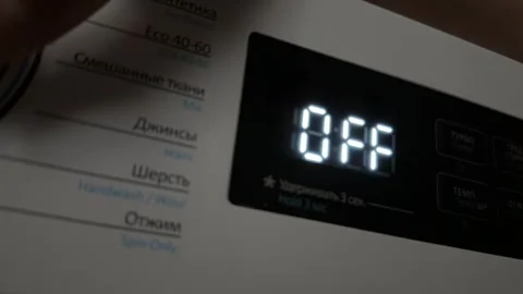 Washing machine turning on and off with digital display close up at home, Stock Footage 337104848