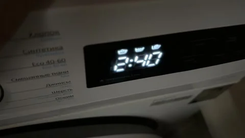 Washing machine turning on and off with digital display close up at home, Stock Footage 337104854