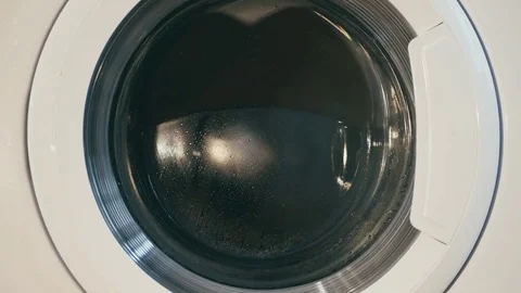 Washing machine turns fast medium shot Video stock 73910132