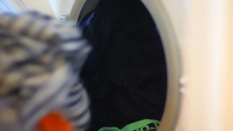 Washing machine unloading close up Stock Footage 119009676