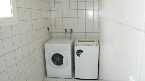 The washing machine view in the room Stock Photos