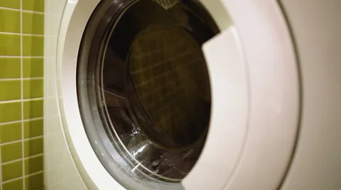 Washing machine washes clothes Stock Footage 45763875