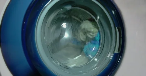 Washing machine washes clothes Stock Footage