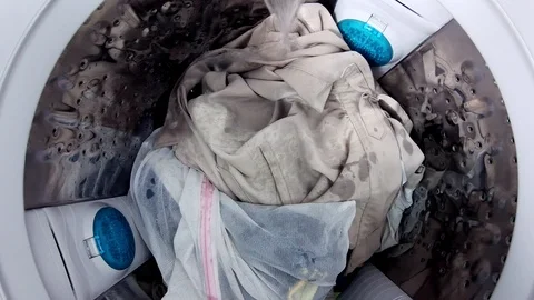 Washing machine washes clothes laundry such as colored,Time lapse Stock Footage 96505620