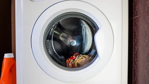 The washing machine washes clothes. Timelapse. Stock Footage 127892466