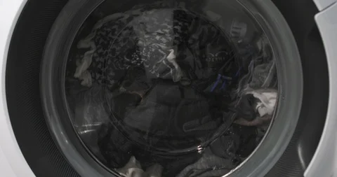 Washing machine washes clothing Stock Footage 104635454
