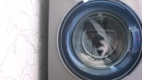 The washing machine washes dirty colored clothes. Stock Footage 246629271