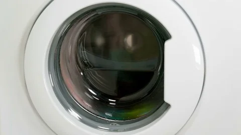 Washing machine is washing clothes Stock Footage 77559904