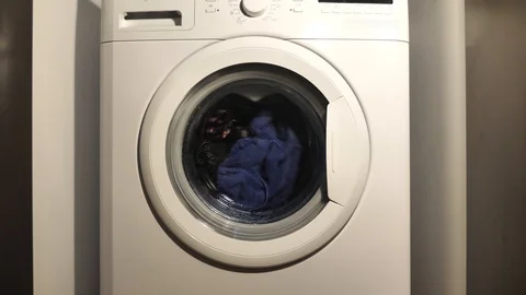 Washing machine washing clothes Stock Footage 106027929