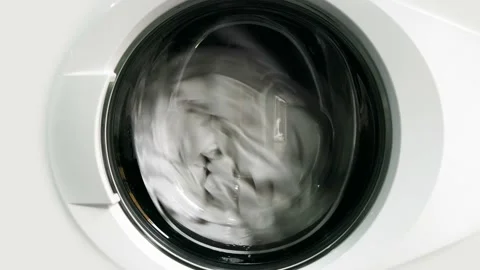 Washing machine washing white clothes Stock Footage 233146927