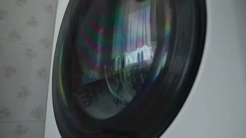 Washing machine working in the bathroom against the window Stock Footage 306124735