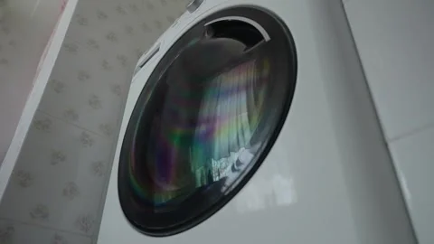 Washing machine working in the bathroom against the window Stock Footage 315171738