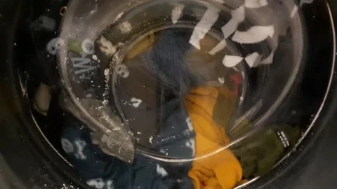 A washing machine works at home Stock Footage 145754443