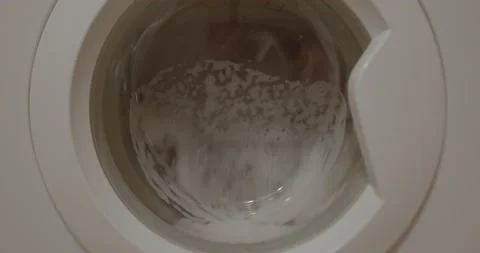 Washing machine works by using water and foam, cycle stop. Vídeos de archivo 178597605